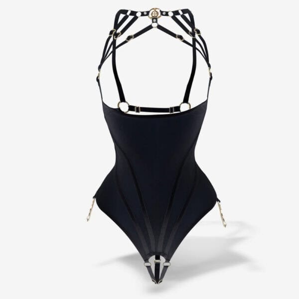 QRUCIFIX body in black mesh with high collar and thin straps, graphic structure and gold metallic details, presented on a white background by Brigade Mondaine Paris.