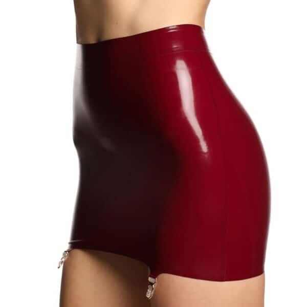 Short skirt in shiny burgundy latex with criss-cross lacing at back and garter belt fastenings.