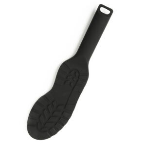 Paddle noire texturée avec poignée ergonomique et surface structurée, accessoire BDSM proposé par Brigade Mondaine Paris.