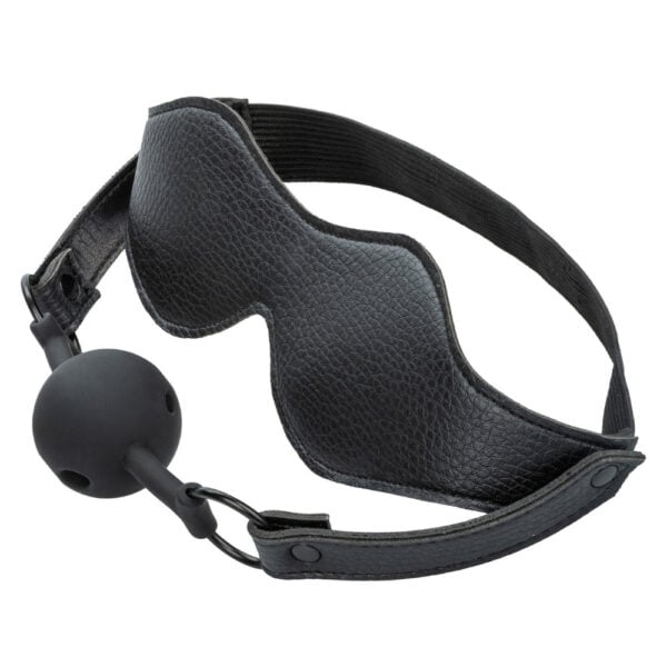Stirnband aus schwarzem Leder mit elastischem Riemen und integriertem schwarzem Silikon-Gag, BDSM-Zubehör, angeboten von Brigade Mondaine Paris.