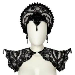 Handmade in Italy with custom floral embroidery on black mesh, this sculptural epaulette is reinforced with internal metal boning along the shoulder line to maintain its dramatic, elevated silhouette. Adjustable elastic bands positioned under the arms ensure comfort and stability while preserving structure. Front opening with metal clasp for a clean neckline and easy wear. Lightweight yet statement-making — a refined construction that balances delicacy and strength. Available in multiple sizes. Please refer to our size guide to select your perfect fit. This listing is for the epaulettes only. Other garments and accessories shown in photos are for styling purposes.